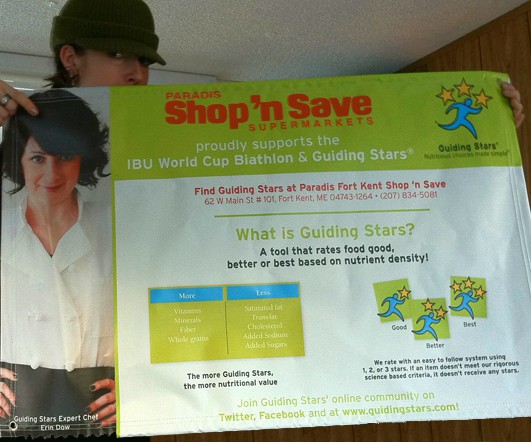Erin holding Guiding Stars banner Erin holding Guiding Stars banner